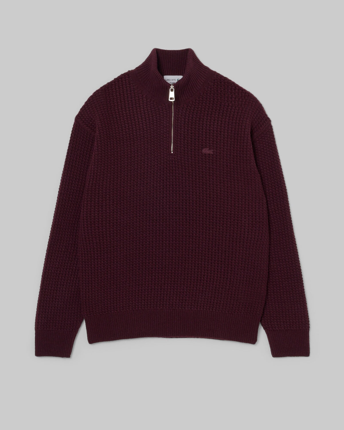 Pull col montant zippé Lacoste en laine bordeaux, vue à plat