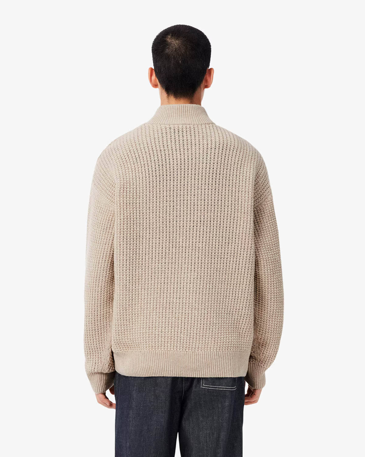 Pull col montant zippé Lacoste en laine beige, porté de dos