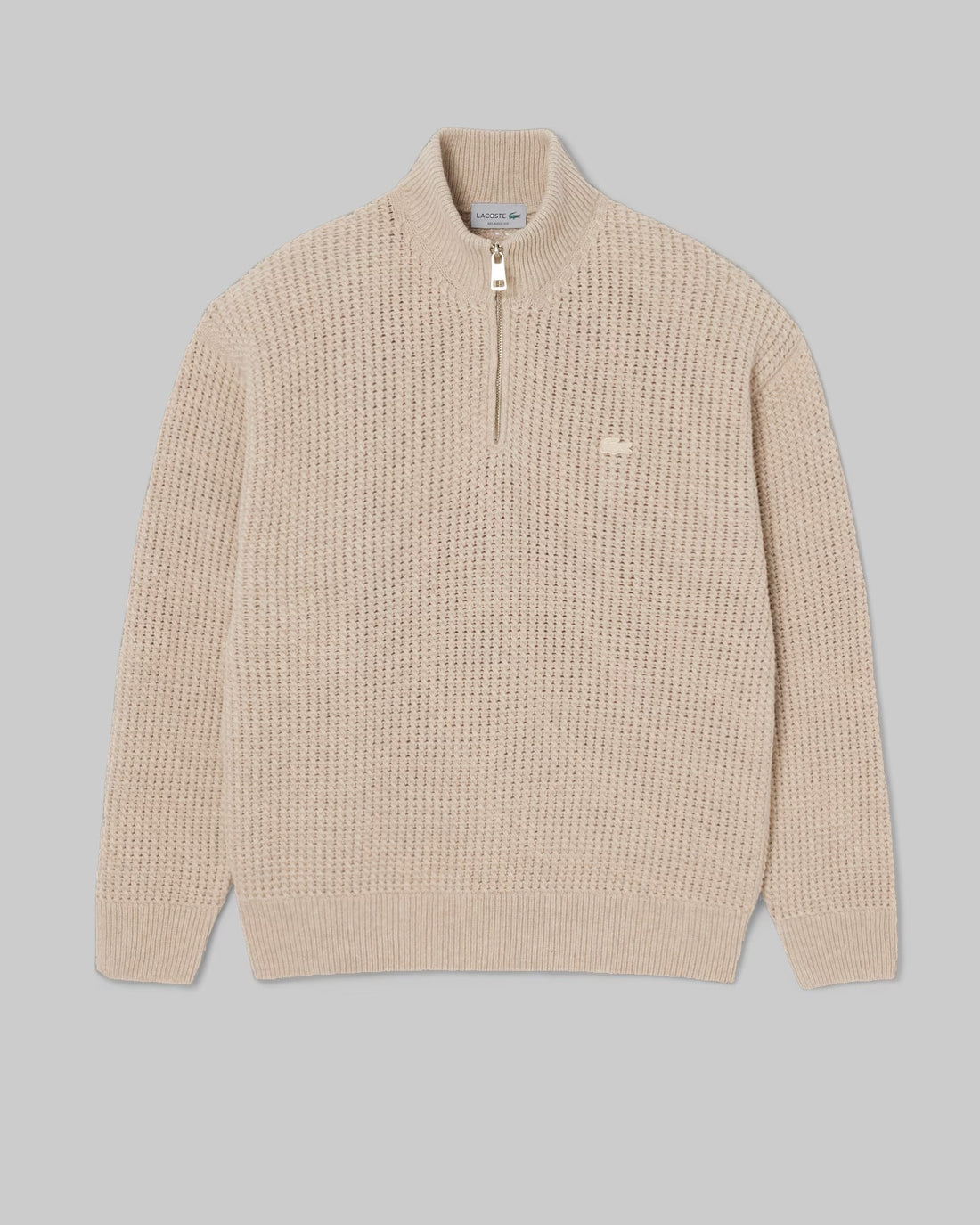 Pull col montant zippé Lacoste en laine beige, vue à plat