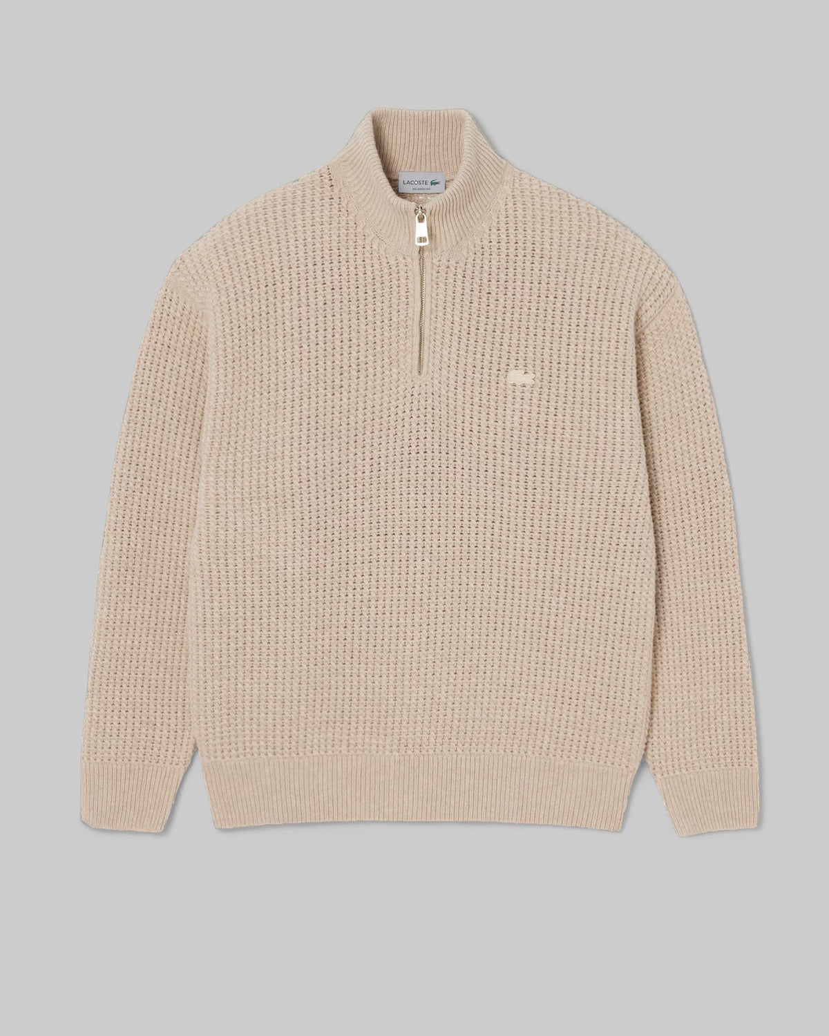 Pull col montant zippé Lacoste en laine beige, vue à plat